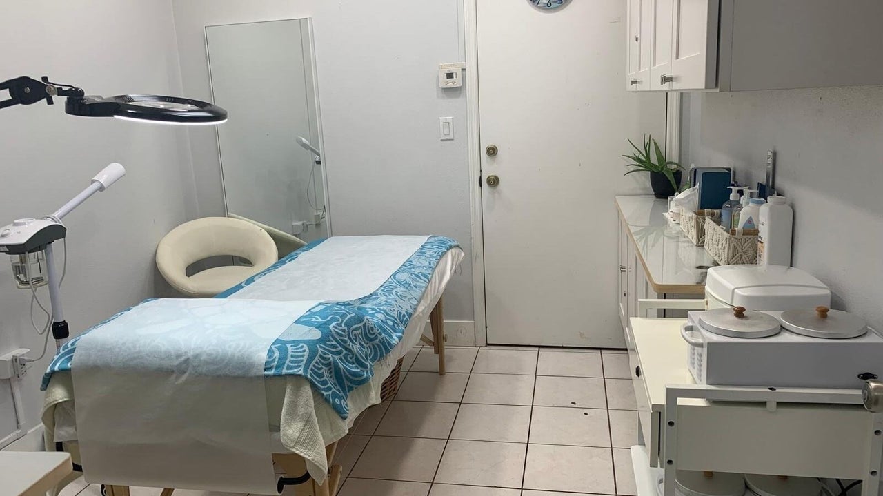A calm treatment room prepared for a guest
